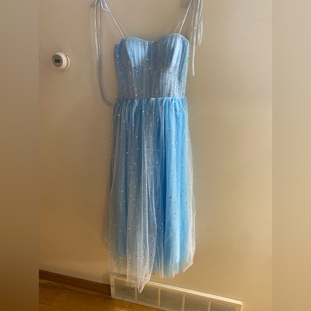 Blue sparkly moon and star dress.